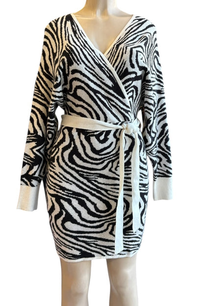 Zebra print dress with a belt on a mannequin against a white background