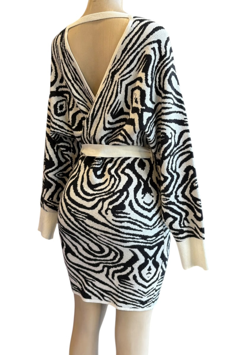 Zebra print dress on a mannequin against a white background