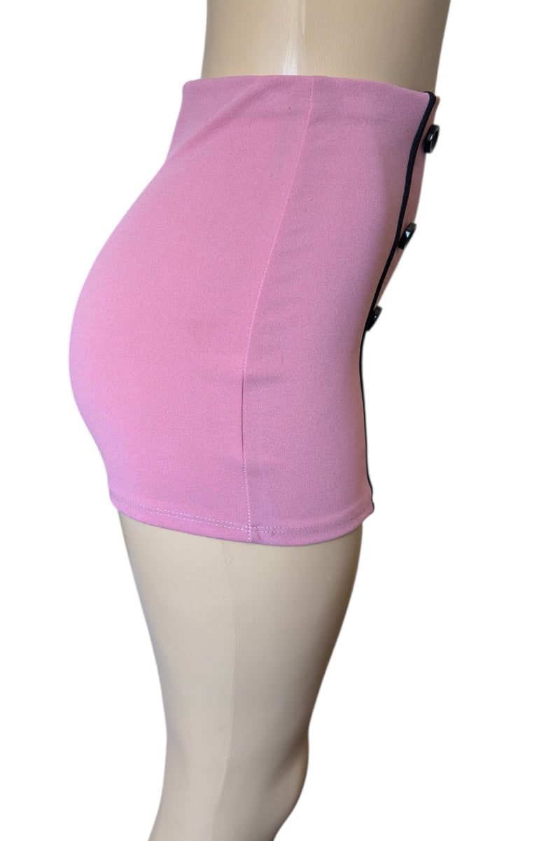 Pink shorts on a mannequin against a white background