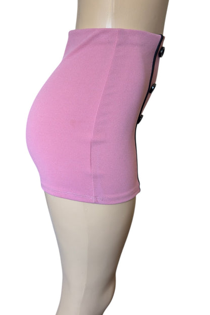 Pink shorts on a mannequin against a white background