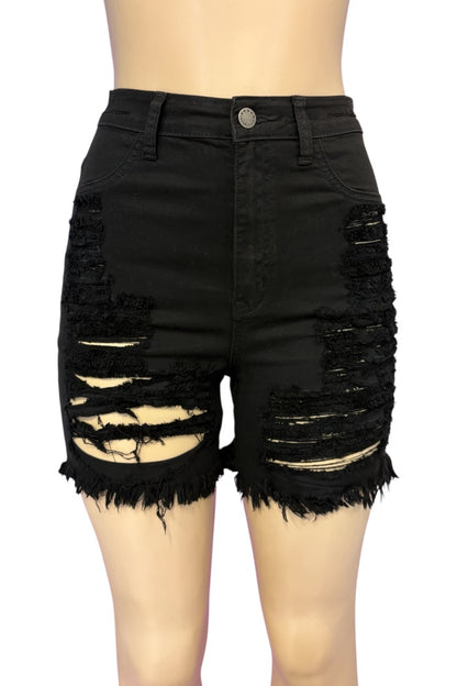 Black high-waisted distressed denim shorts with heavy ripped detailing and frayed hems, shown on a mannequin torso against a white background.