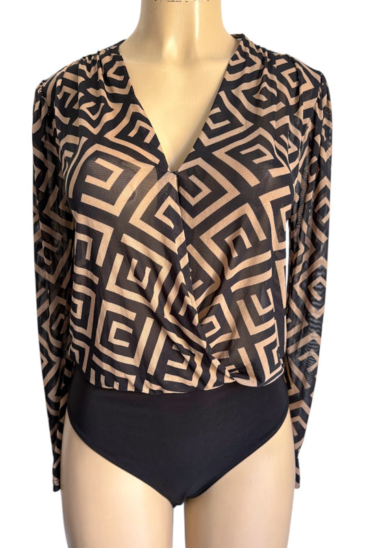 Mannequin wearing a patterned long-sleeve top and black bodysuit.