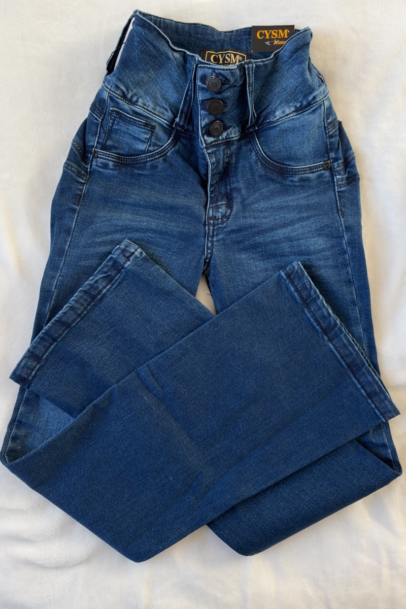 Folded blue jeans with a brand label on a white background