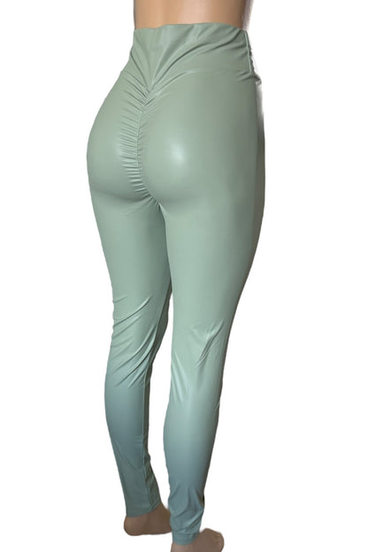 Mint green leggings on a white background