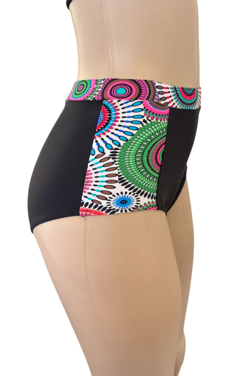 Colorful patterned bikini on a mannequin with a white background