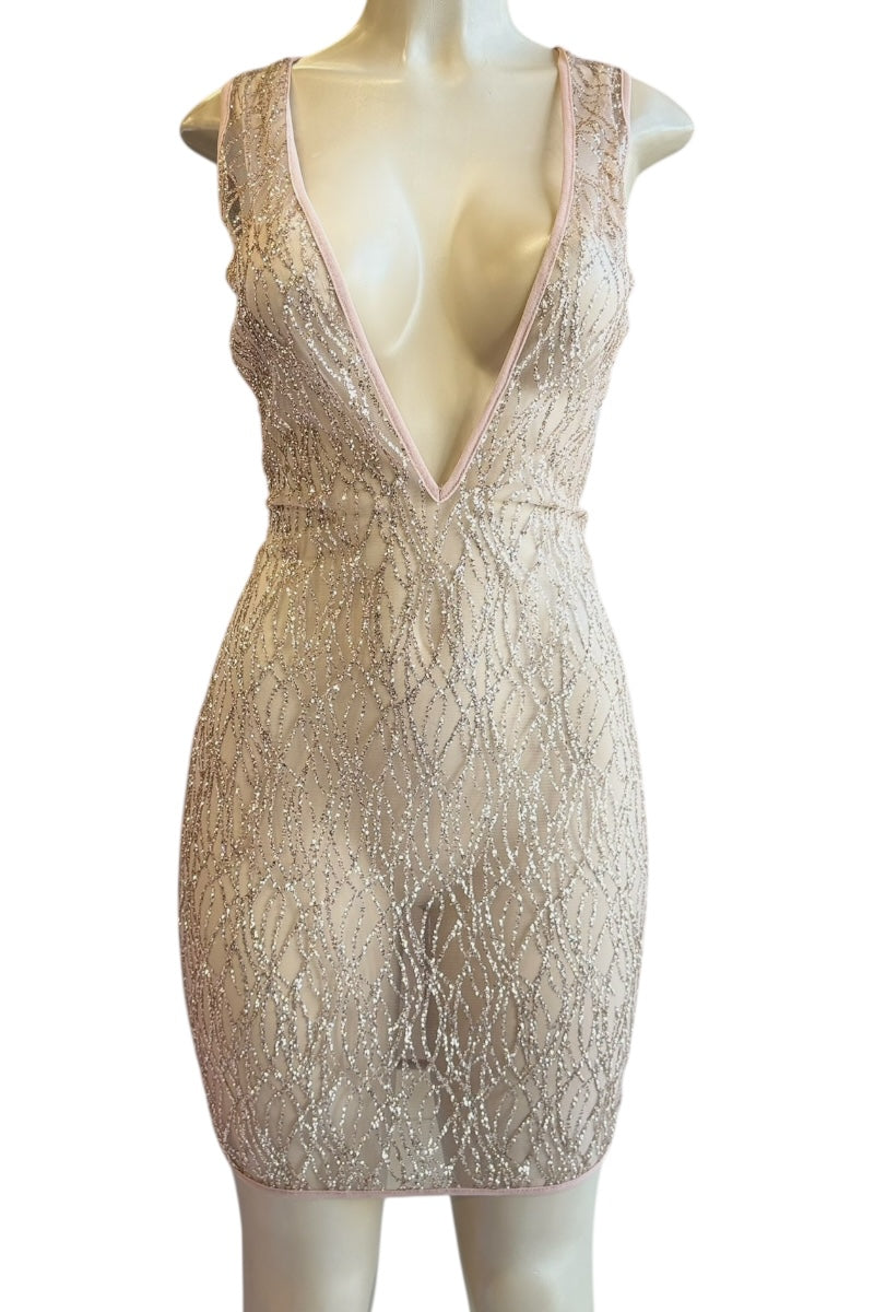 pink sequin dress on a mannequin against a white background