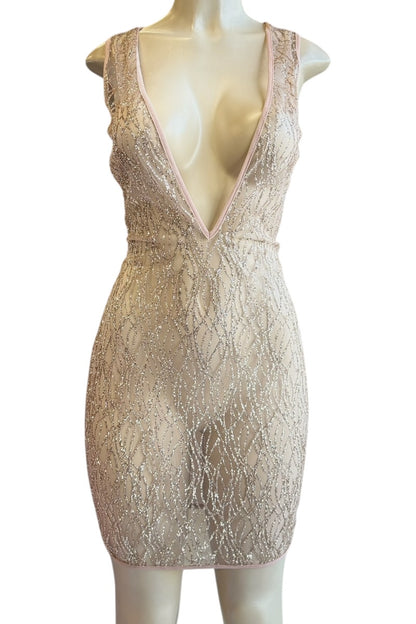 pink sequin dress on a mannequin against a white background