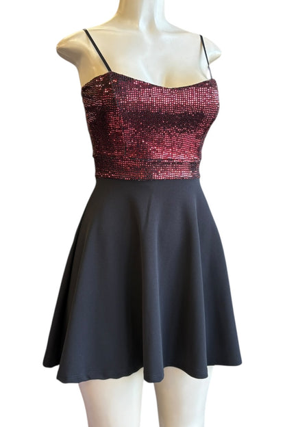 Dress with sequined top and plain skirt on a mannequin against a white background