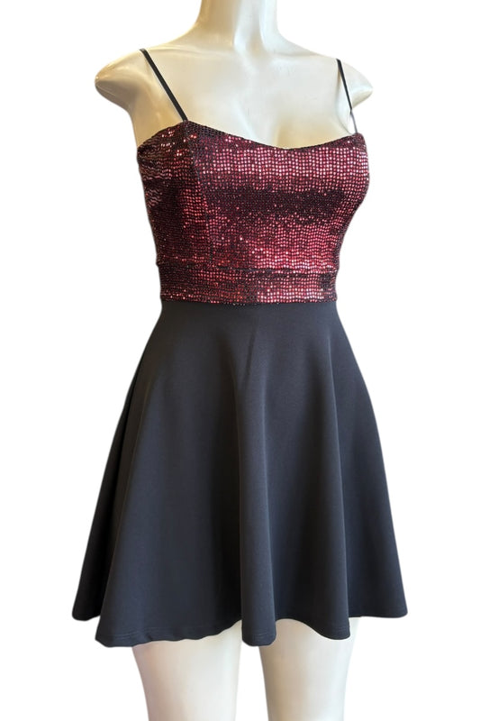 Dress with sequined top and plain skirt on a mannequin against a white background