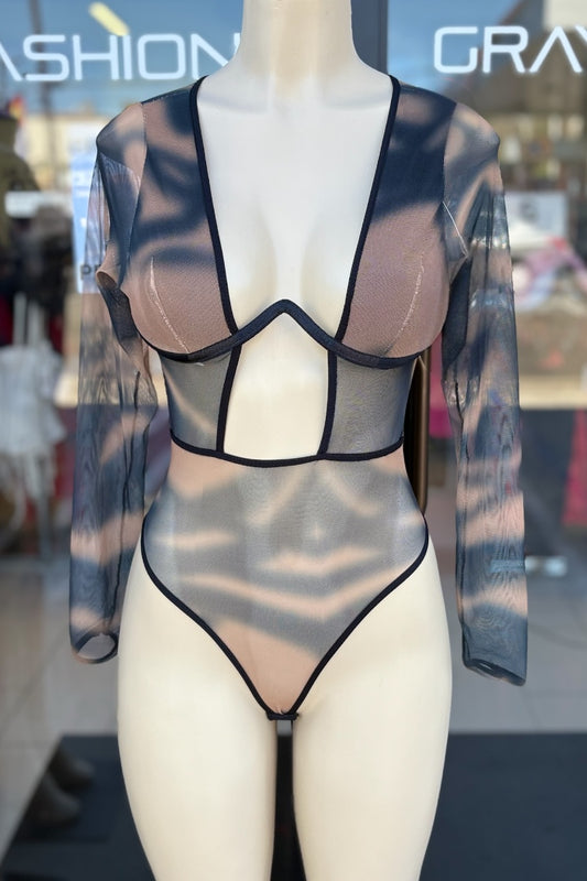 Mannequin wearing a sheer brown and  black bodysuit with a blurred background