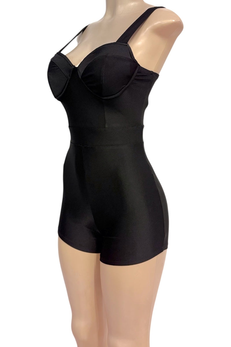 Black romper with a built-in bra and high-waisted shorts, displayed on a mannequin against a white background.