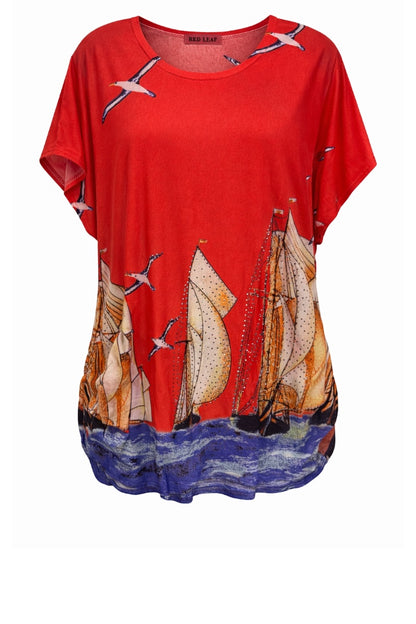 Red t-shirt with sailboat and seagull design on a white background