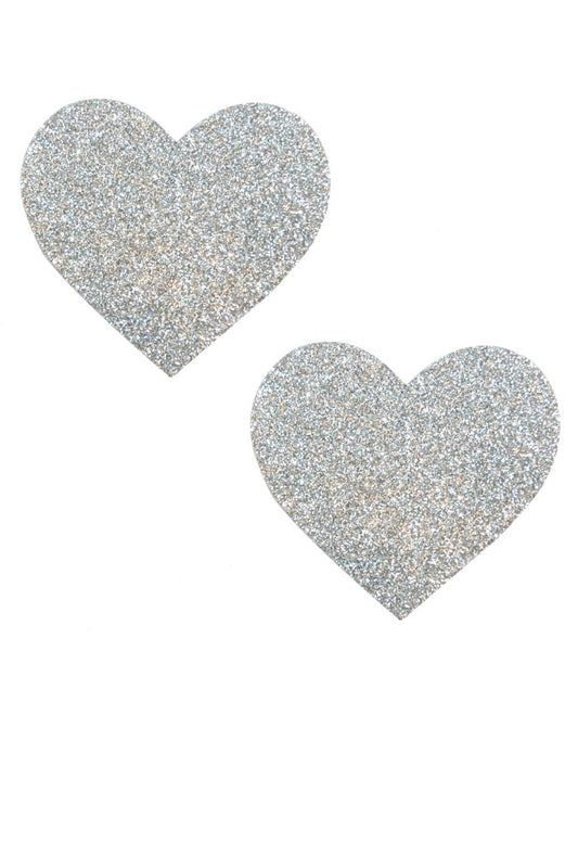 Two glittery silver heart-shaped pasties on a white background