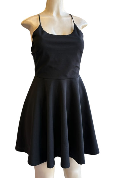 Black dress on a mannequin against a white background