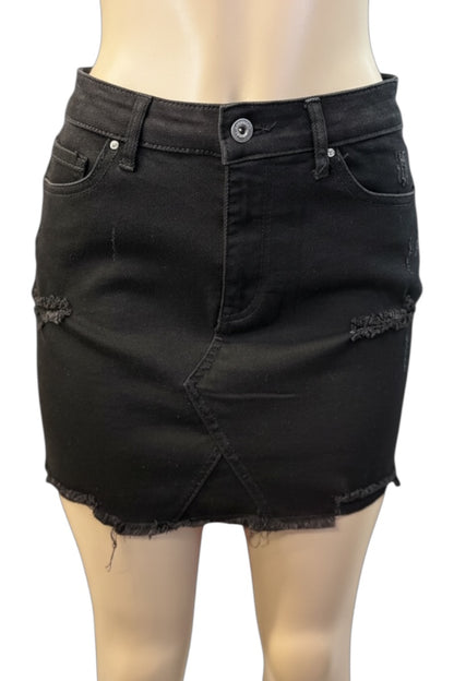 Black denim skirt on a mannequin with a white background
