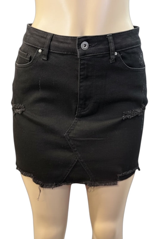 Black denim skirt on a mannequin with a white background