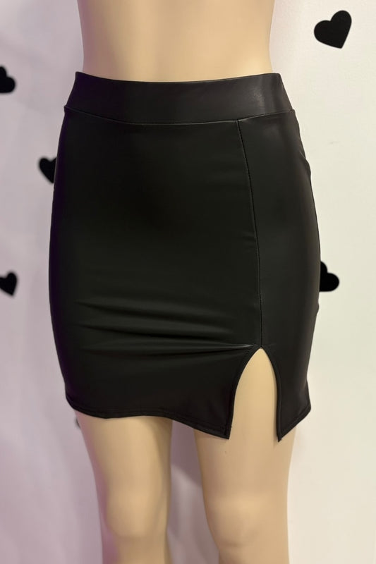 Black leather skirt on a mannequin with a plain background