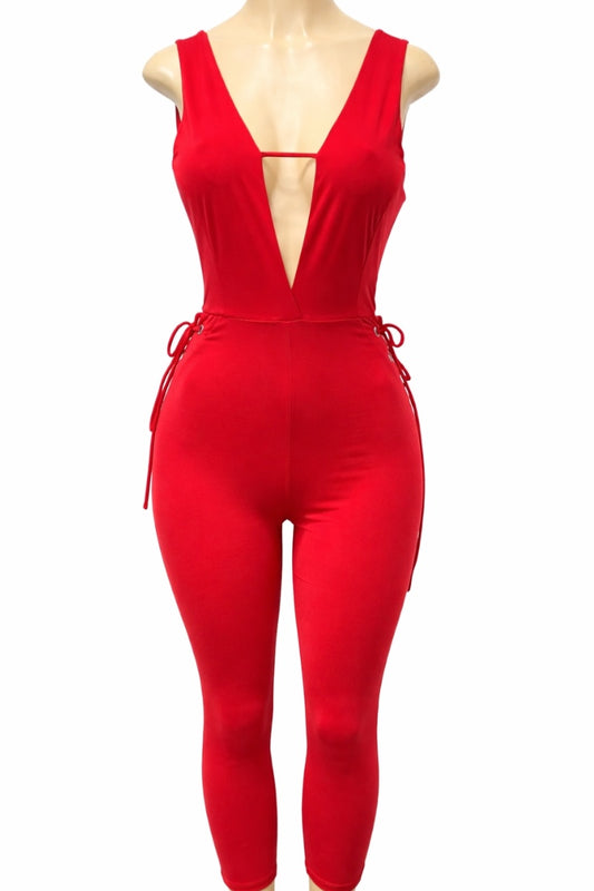 Red jumpsuit on a mannequin against a white background