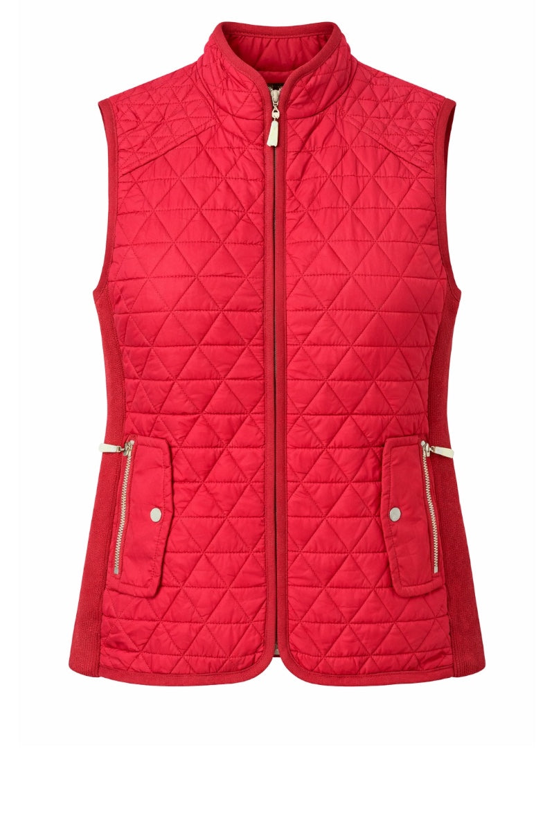 Red quilted vest with zippers on a white background
