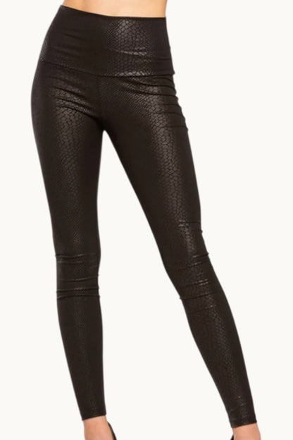 Black leather leggings on a white background