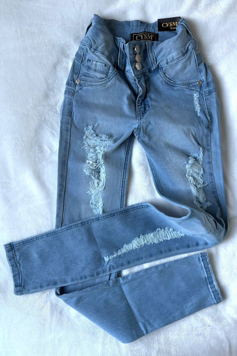 Distressed blue jeans on a white background