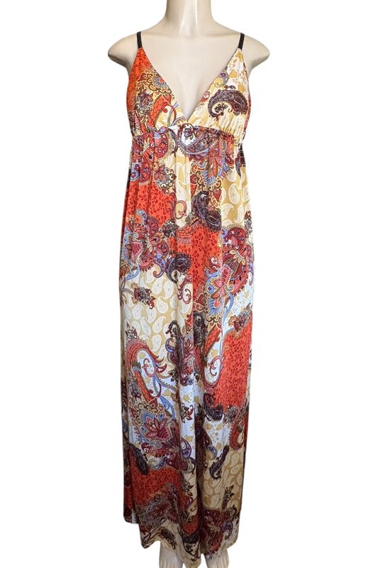 Colorful patterned dress on a mannequin against a white background