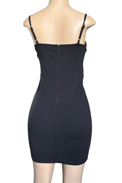 Black dress on a mannequin against a white background