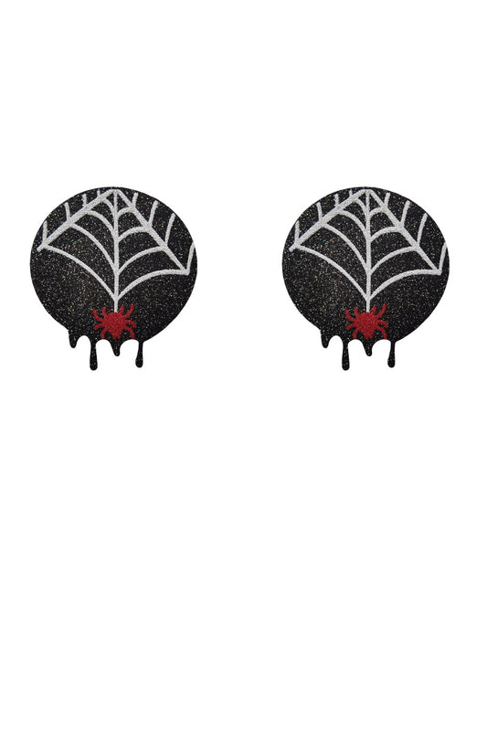 Black spiderweb-shaped pasties with red centers on a white background