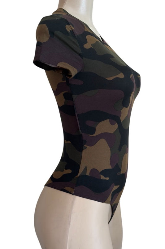 Camouflage-patterned top on a mannequin against a white background
