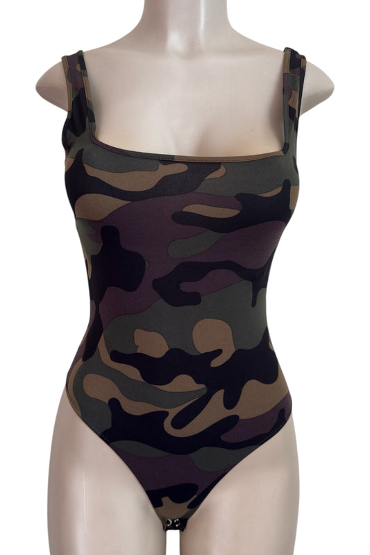 Camouflage bodysuit on a mannequin against a white background