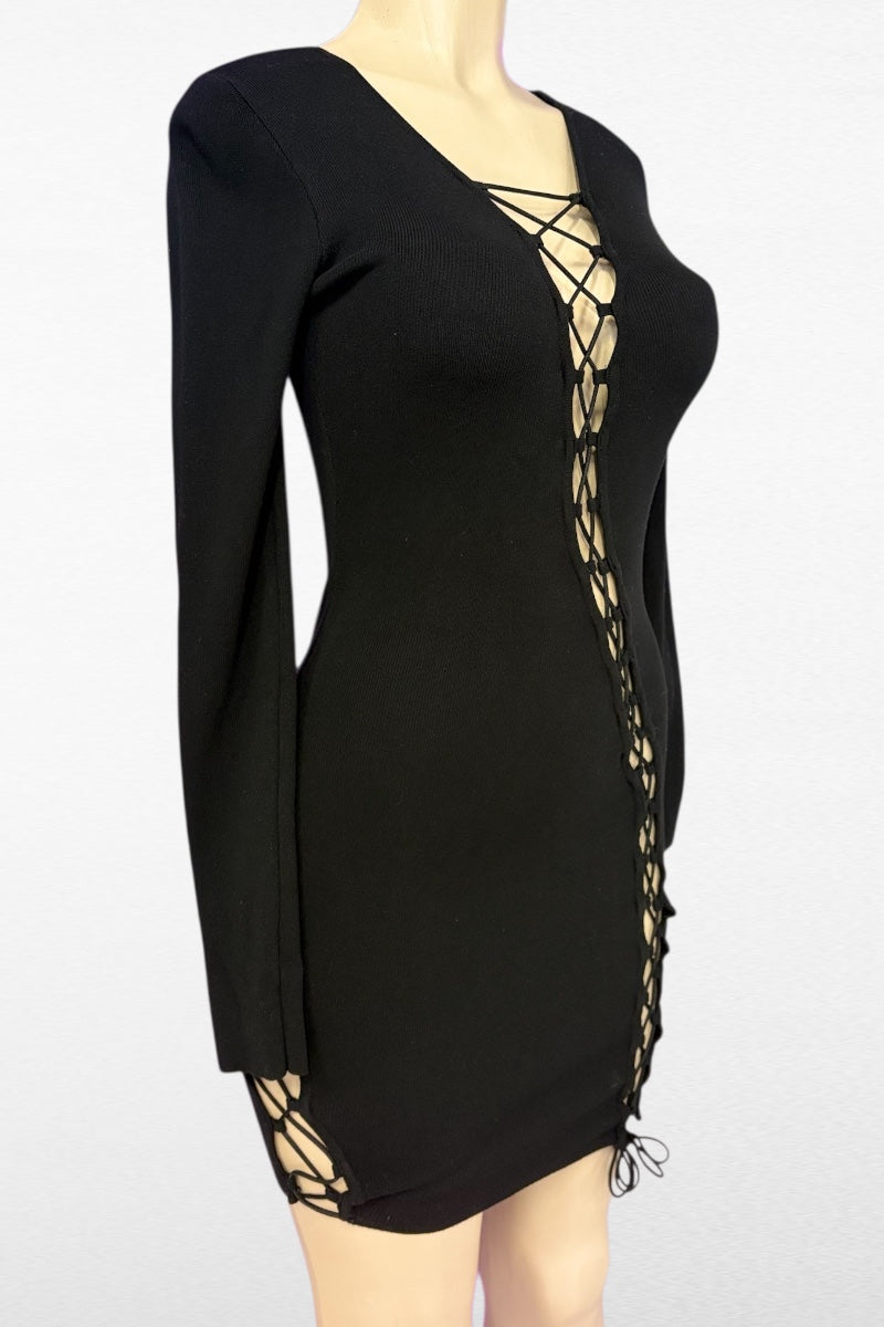Black dress with lace-up sides on a mannequin against a white background