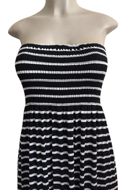 Black and white striped dress on a mannequin against a white background