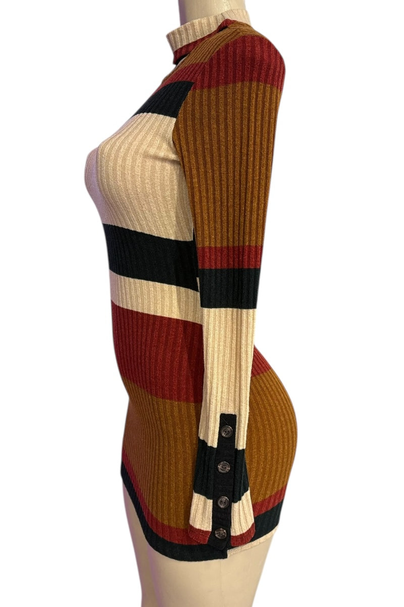 Color-blocked ribbed knit sweater on a mannequin against a white background