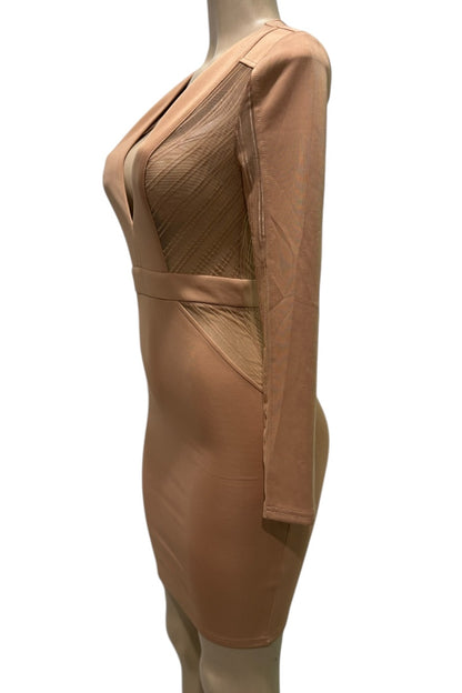 Beige dress on a mannequin against a white background