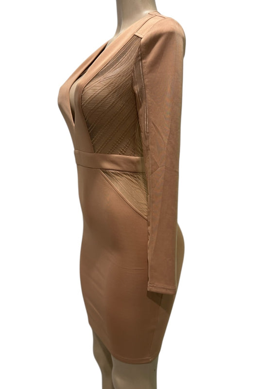 Beige dress on a mannequin against a white background