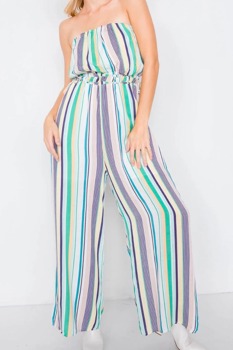 Multicolored striped jumpsuit worn by a person on a white background