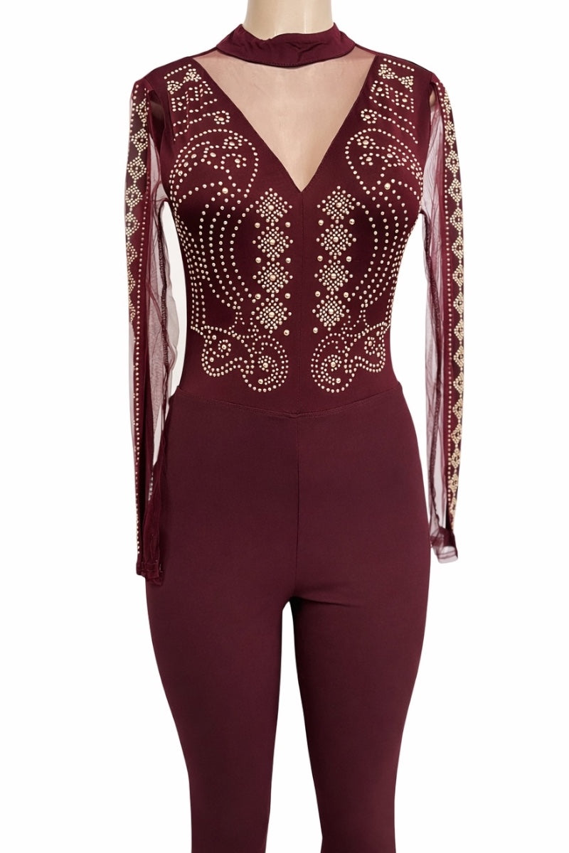 wine jumpsuit with sheer sleeves and embellishments on a white background