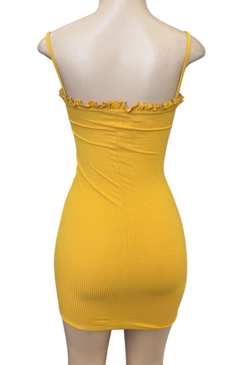 Mustard dress on a mannequin with a white background