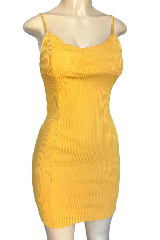 Yellow dress on a mannequin against a white background