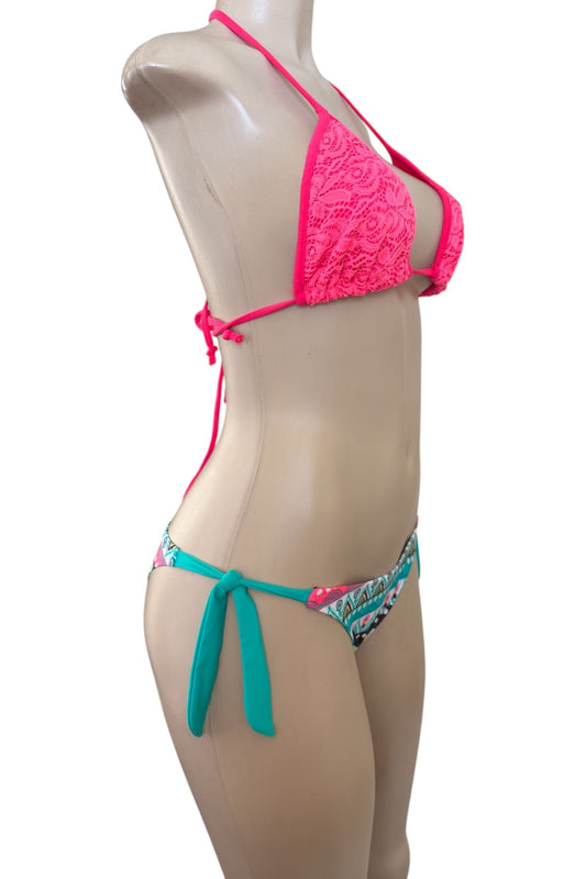 Bikini set on a mannequin with pink top and multicolored bottom against a white background