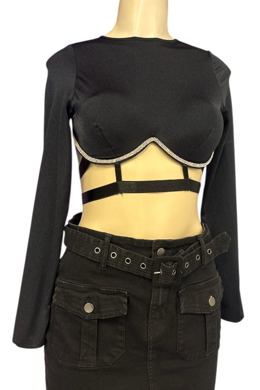 Black long-sleeve top with cutout design on a mannequin against a white background