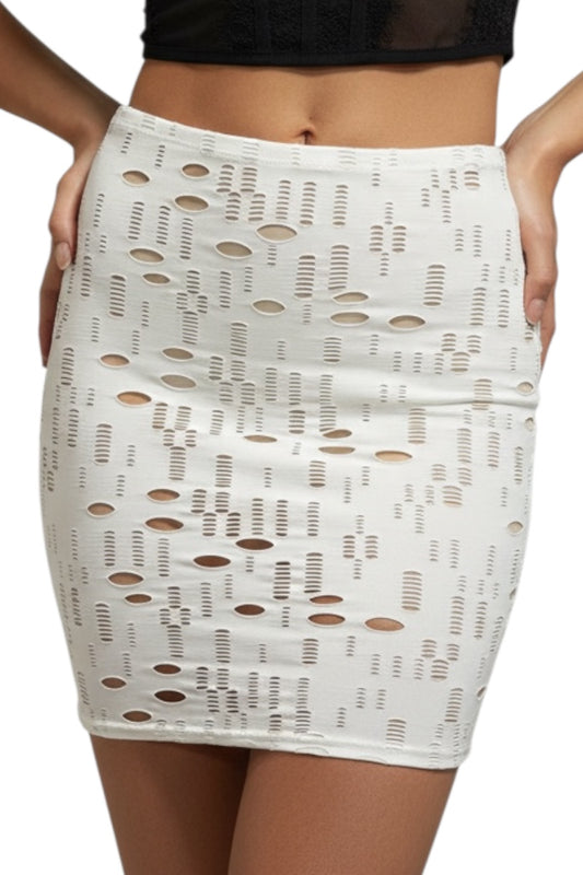 White lace skirt with cut-out pattern worn by a person on a white background