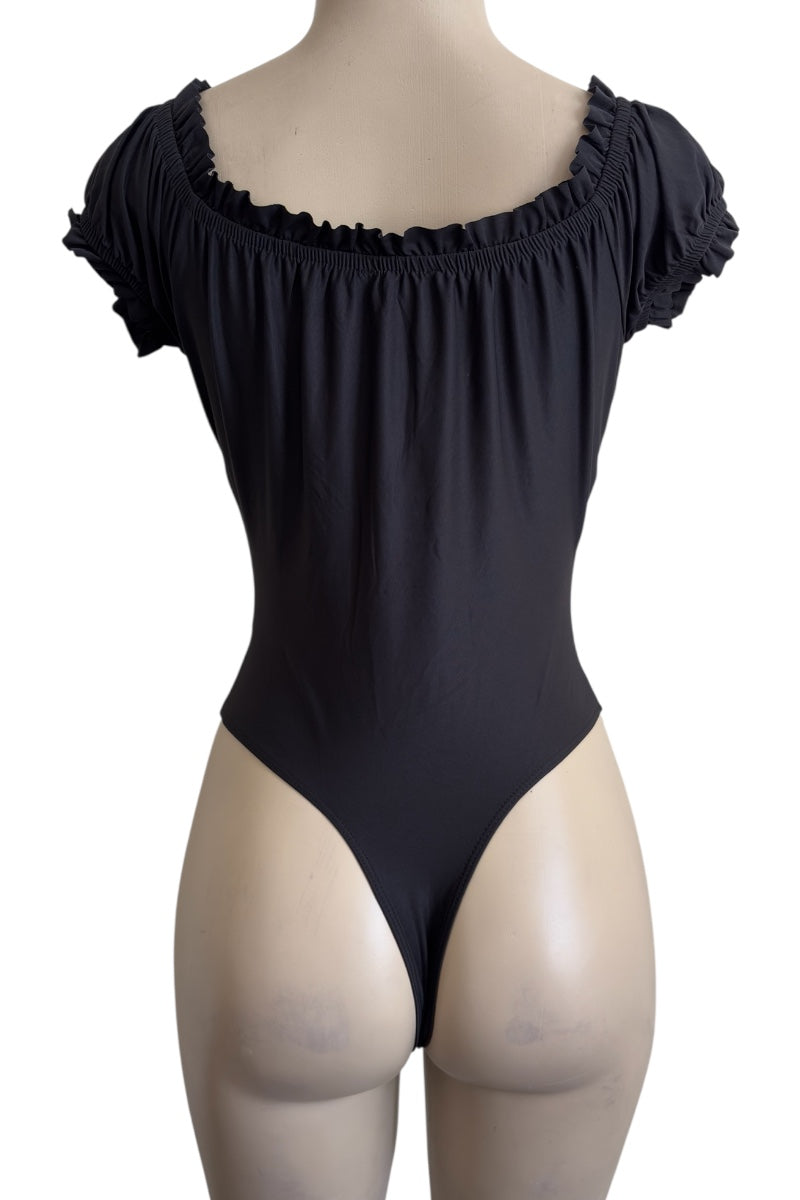 Black bodysuit on a mannequin with a plain background
