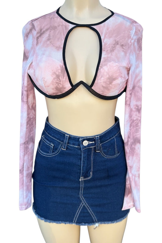 Mannequin wearing a pink tie-dye long-sleeve top with cut-out design and a blue denim skirt.