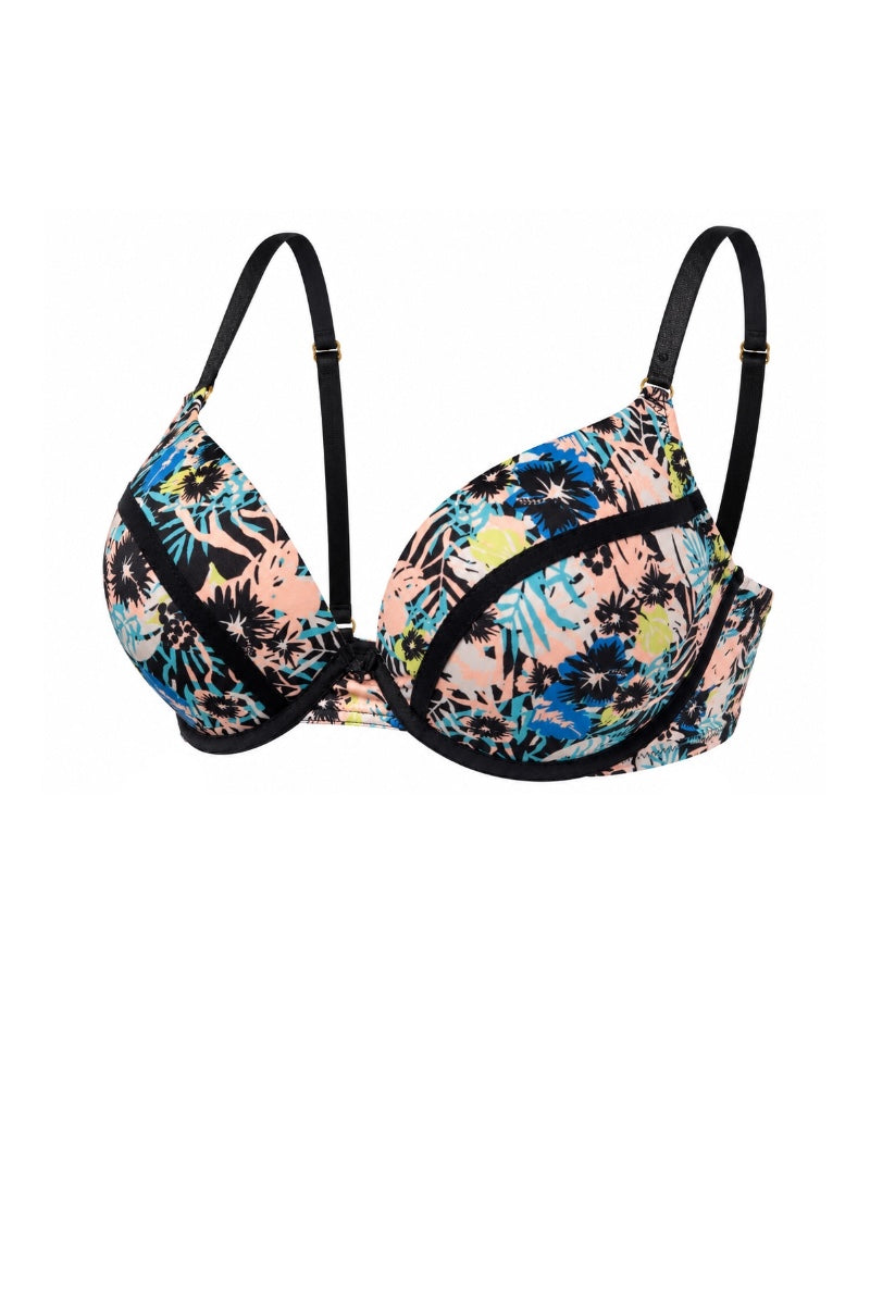 A women's underwire bra with a vibrant tropical floral print in pink, blue, yellow, and black, featuring solid black straps and trim, shown against a plain white background.