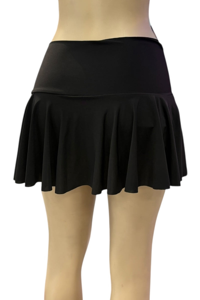 Black skirt worn by a person on a white background