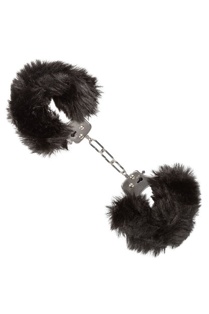 Black furry handcuffs on a white background