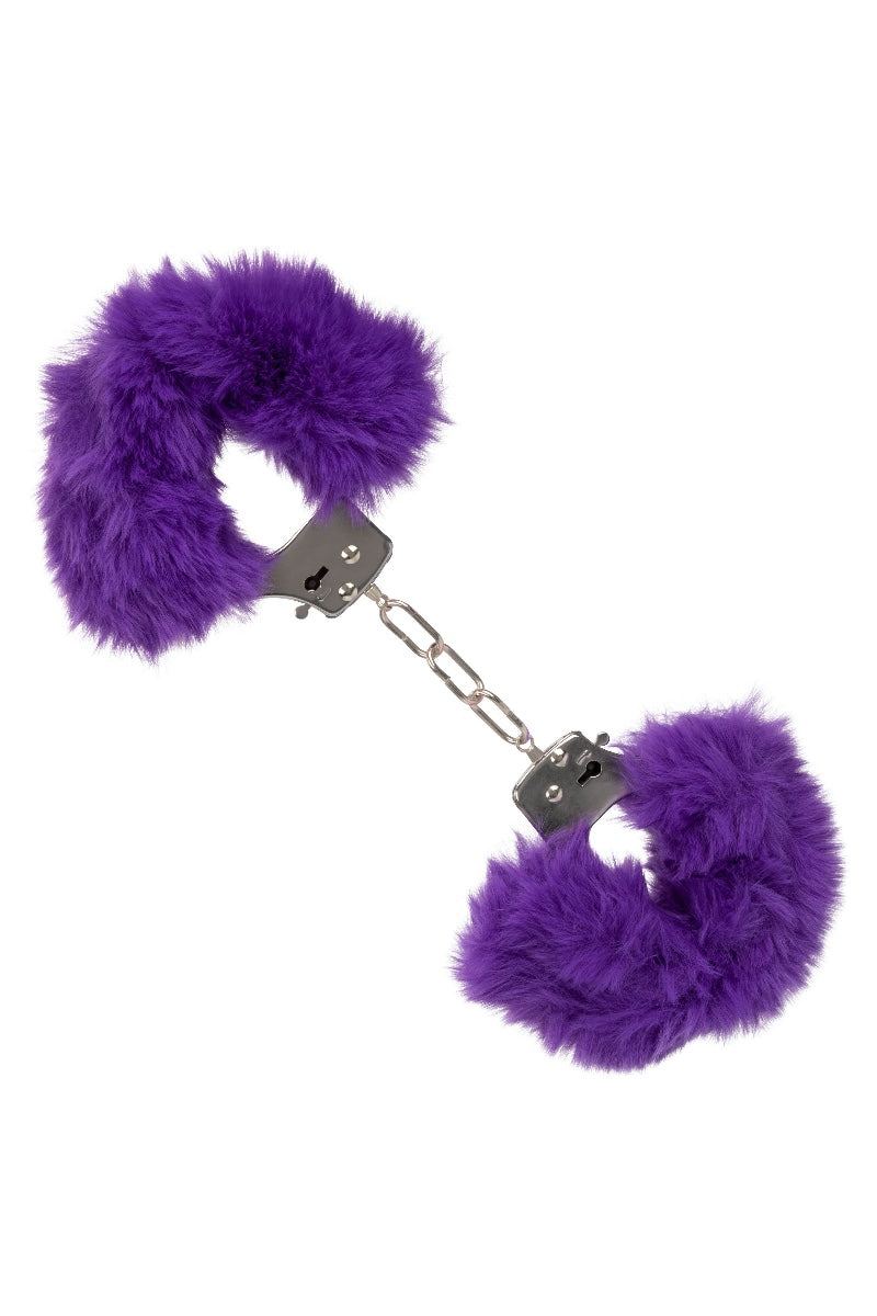 Purple fluffy handcuffs on a white background