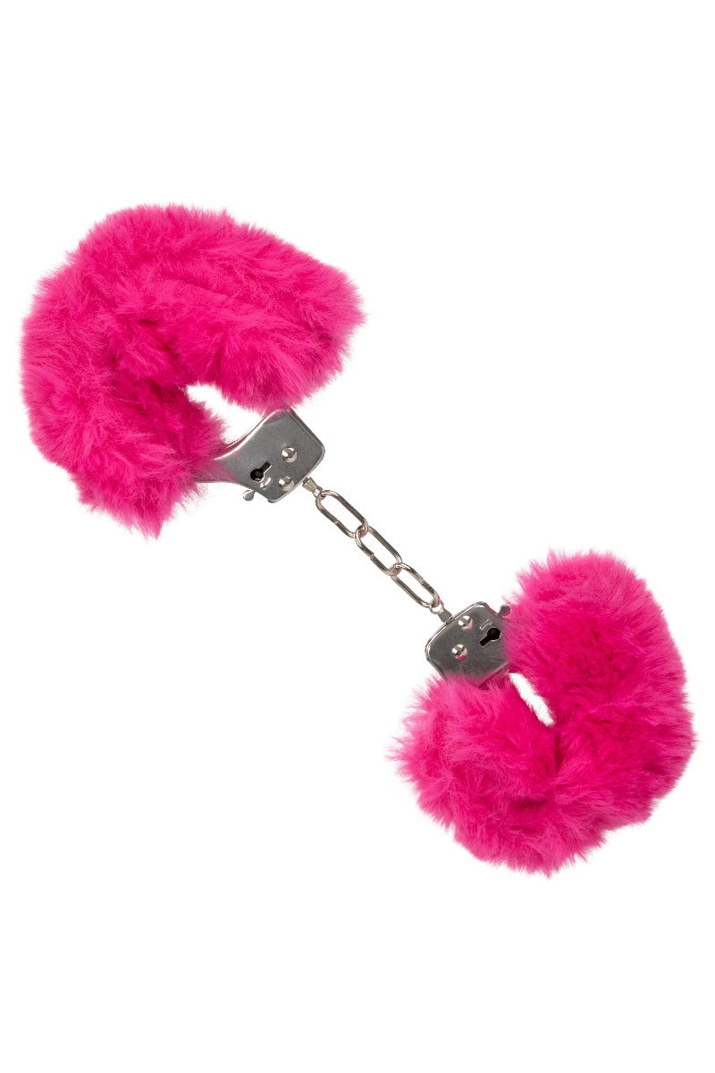 Pink fluffy handcuffs on a white background