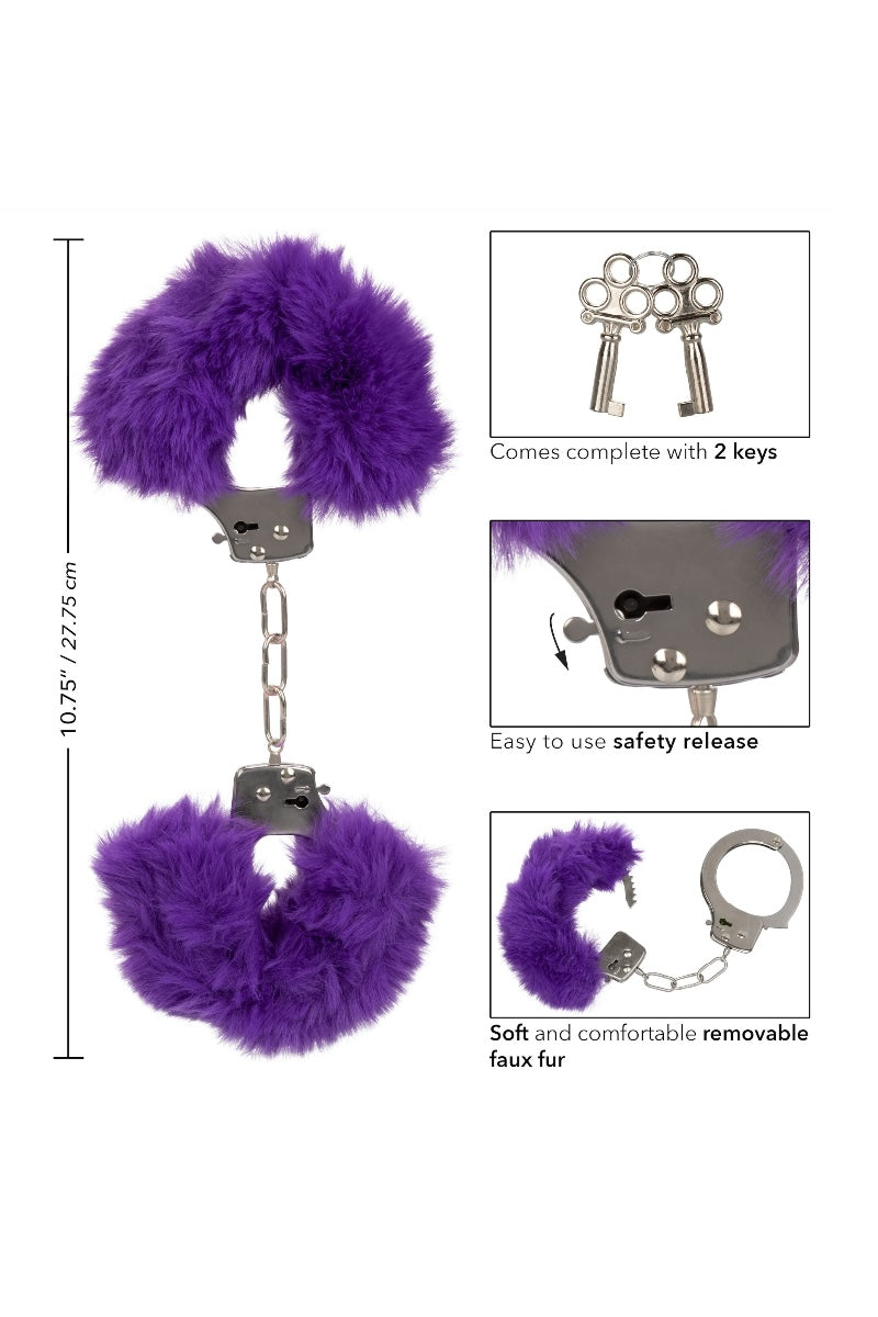 Purple fluffy handcuffs with keys on a white background